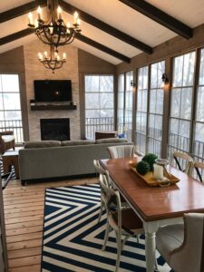 3 season porch w chandelier, fireplace, tv