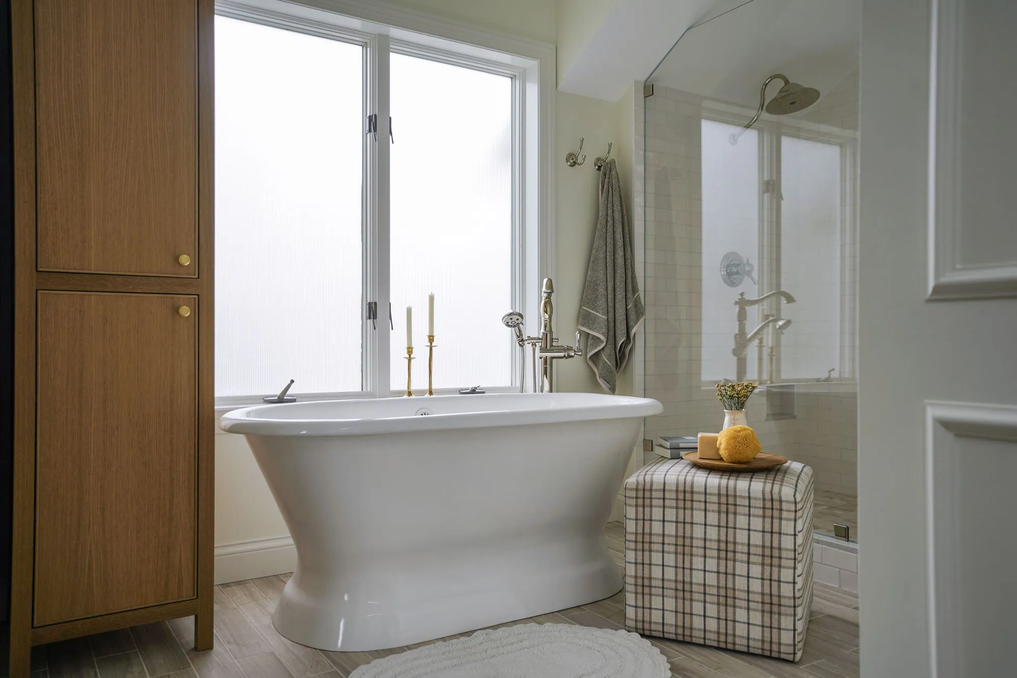 Bathroom with soaking tub and new built in shower with glass wall and rain head