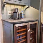 Built in beverage station with wine and beverage cooler on bottom and coffee station on counter